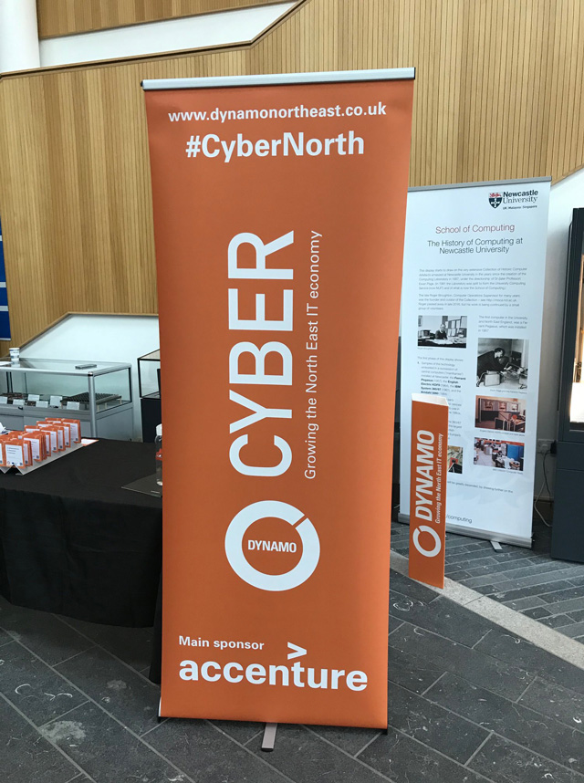 An orange banner with the website www.dynamonortheast.co.uk and #CyberNorth at the top,
the Dynamo logo and Cyber: Growing North East IT economy in the middle
and their Main sponsor accenture written at the bottom.