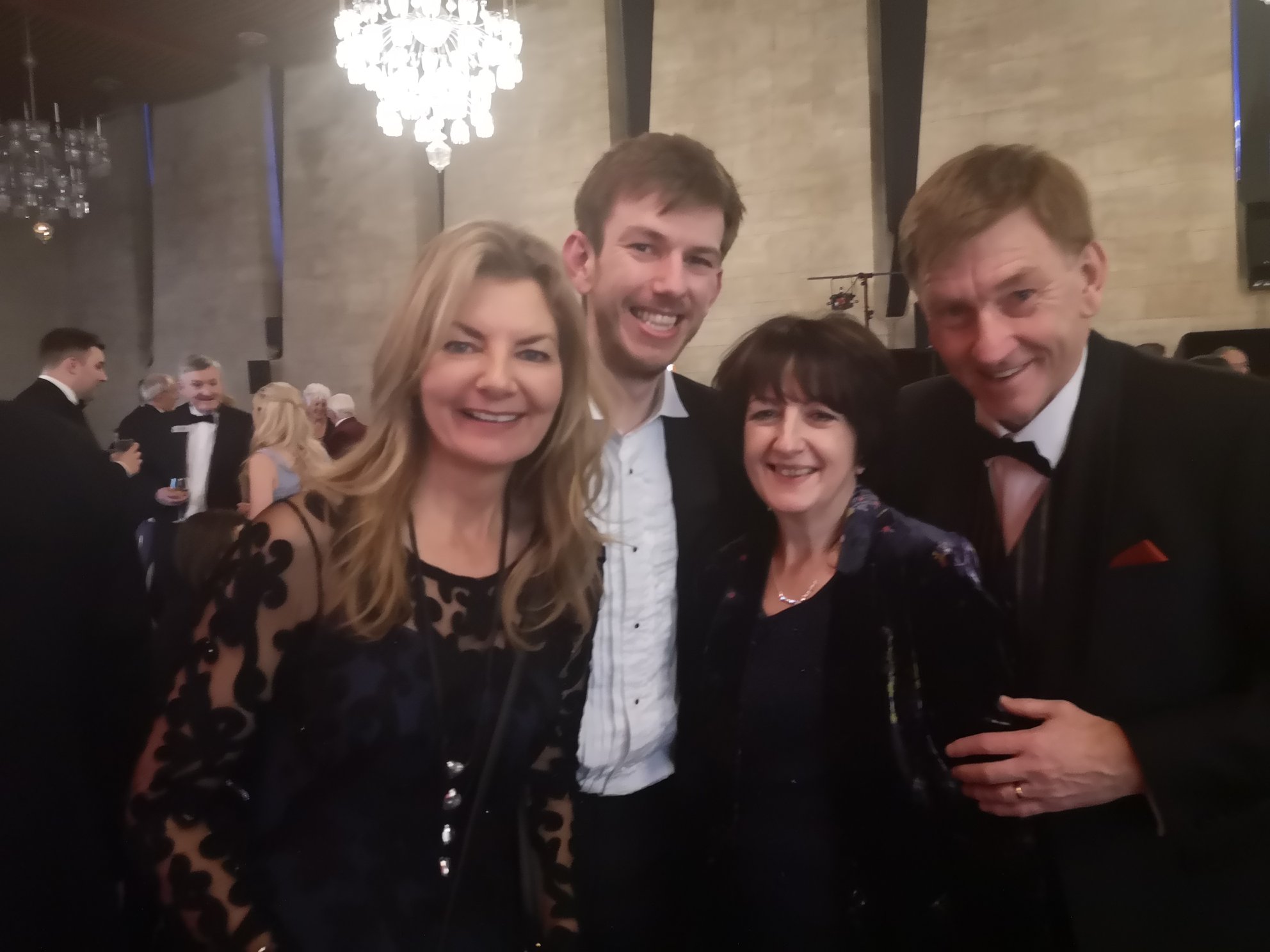 Group photo of Sam, Julie and Colin Hutson with comedian Jo Caulfield