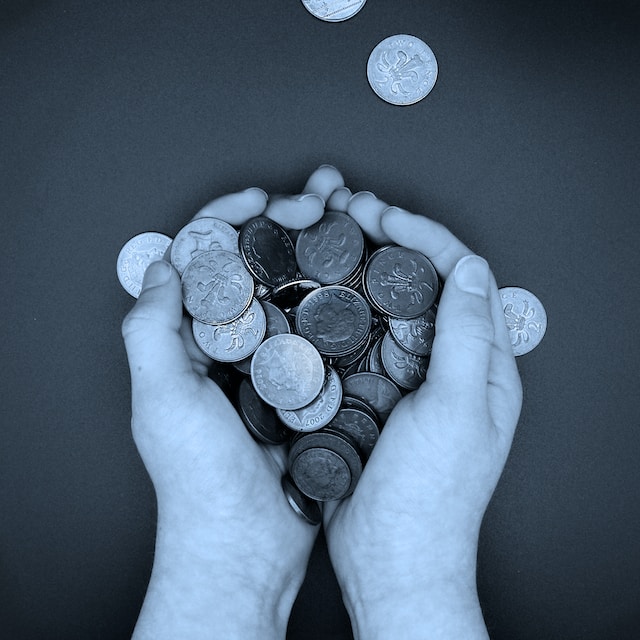 holding coins in hands
